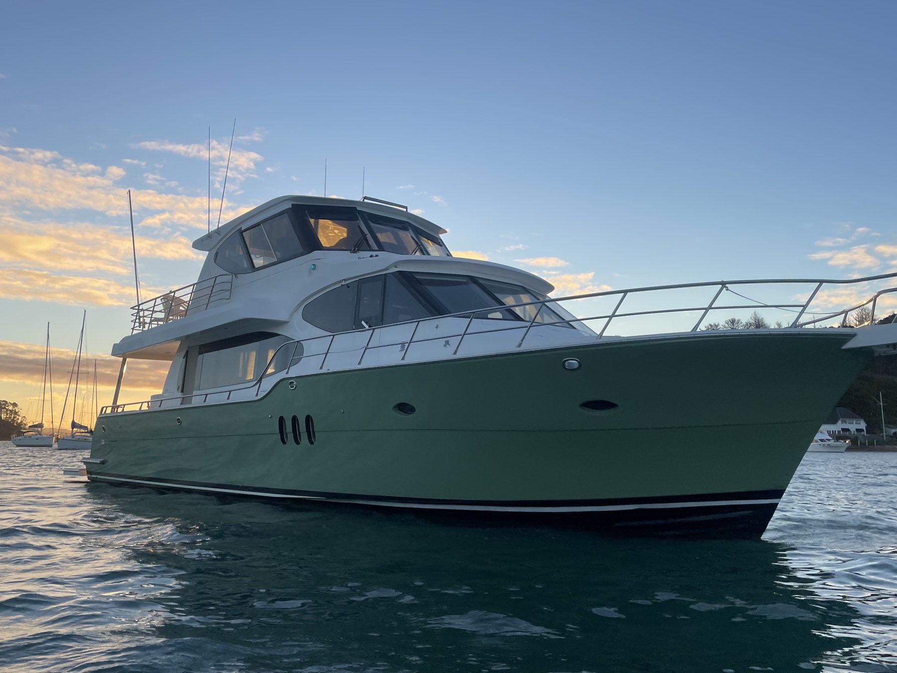 Bow of the Thirsty Whale luxury launch at dusk on the Hauraki Gulf